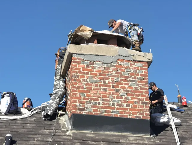 Derby Chimney Sweep installing a custom chimney crown in Derby, CT