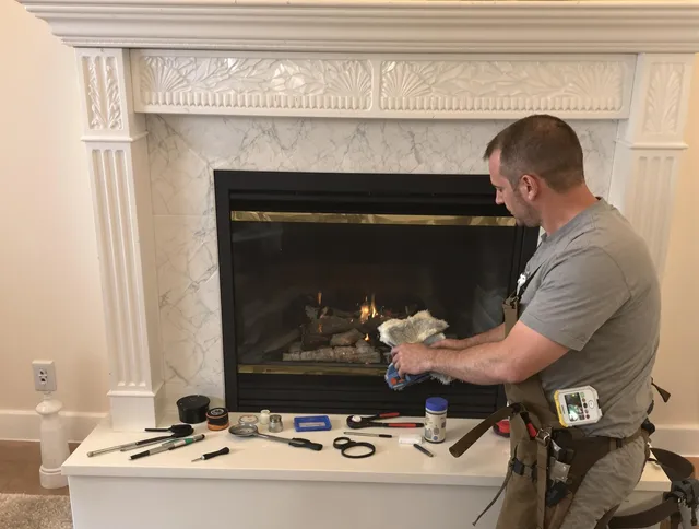 Derby Chimney Sweep performing fireplace maintenance in Derby, CT