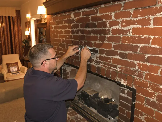 Derby Chimney Sweep expert fixing a fireplace in Derby, CT